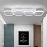 Ceiling light fixture in a modern interior setting with a framed picture on the wall.